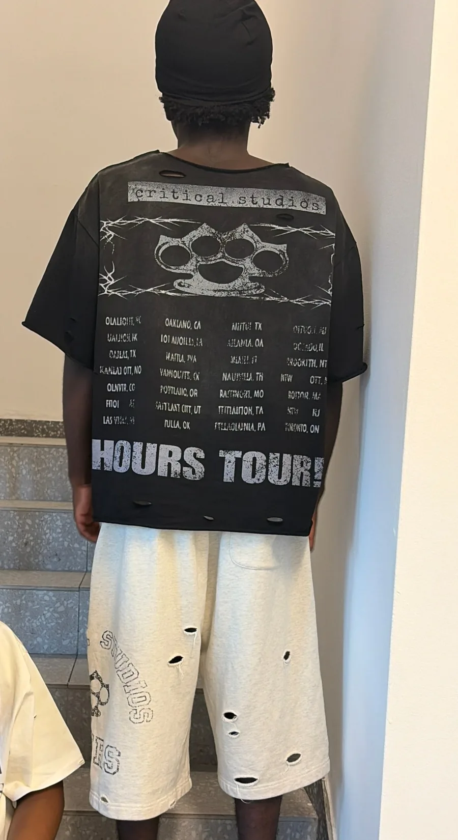 Back of the Influence tee with the Hours Tour print, with grey Everlasting shorts